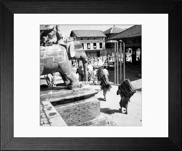 Framed Print : Nepalese women seen here passing one of the temples in Durbar Square