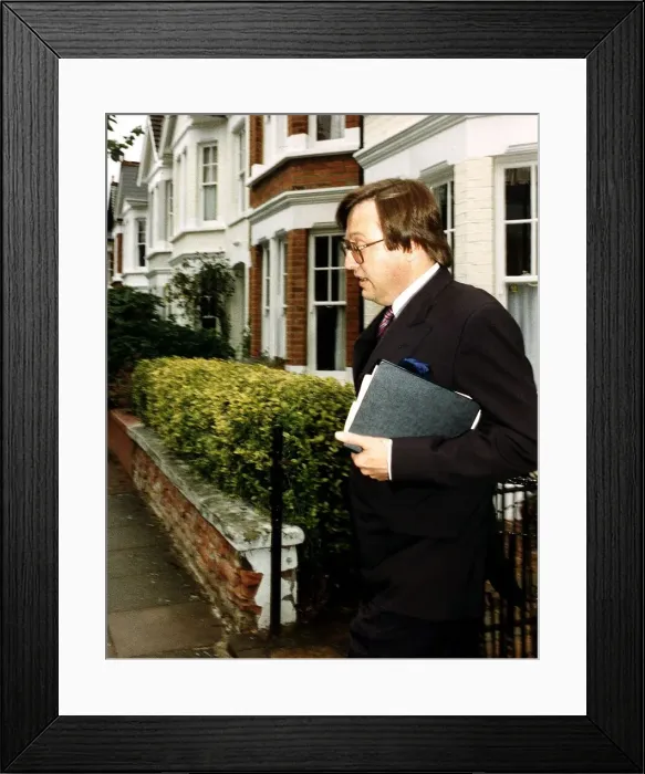 Framed Print : David Mellor Conservative MP looks worried as he leaves his Putney home Framed Print : David Mellor Conservative MP looks worried as he leaves his Putney home