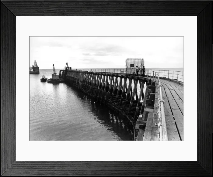Framed Print : A pair of young anglers prepare to enjoy a quite afternoon fishing on Blyth Pier