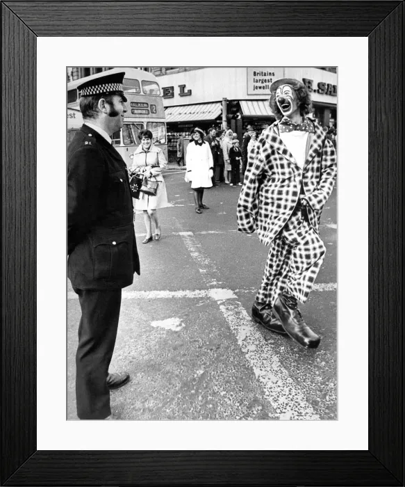 Framed Print : A policeman having a joke with a clown at the opening of the Newcastle Festival Parade in Framed Print : A policeman having a joke with a clown at the opening of the Newcastle Festival Parade in