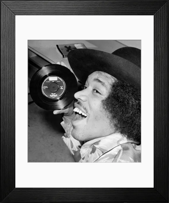 Framed Print : Jimi Hendrix with a copy of his new 7'release with Curtis Knight - Hush Now