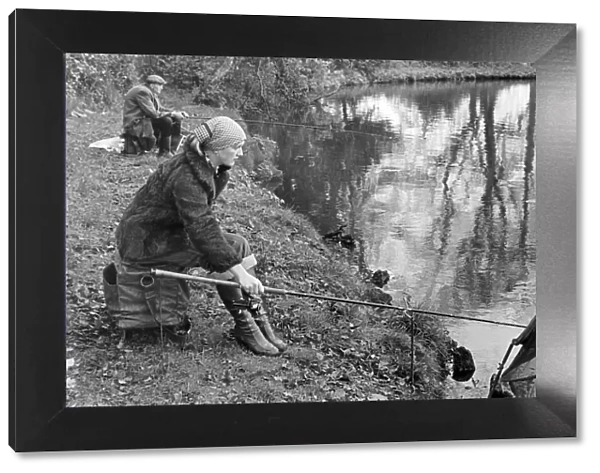 Woman angler seen here on the banks of the River Trent. 22nd November 1977