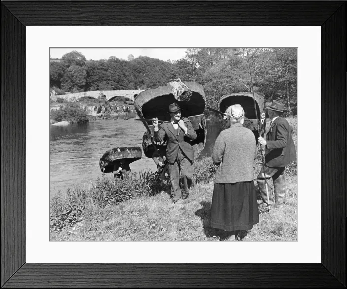 Framed Print : Village shipyard builds coracles for salmon fishing. They are going all out in