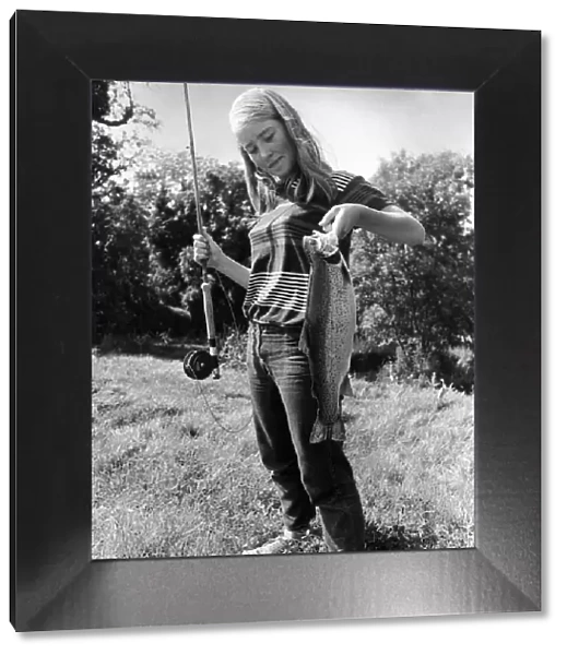 Celia Reade, aged 14 seen here shortly after landing a trout following a fishing lesson