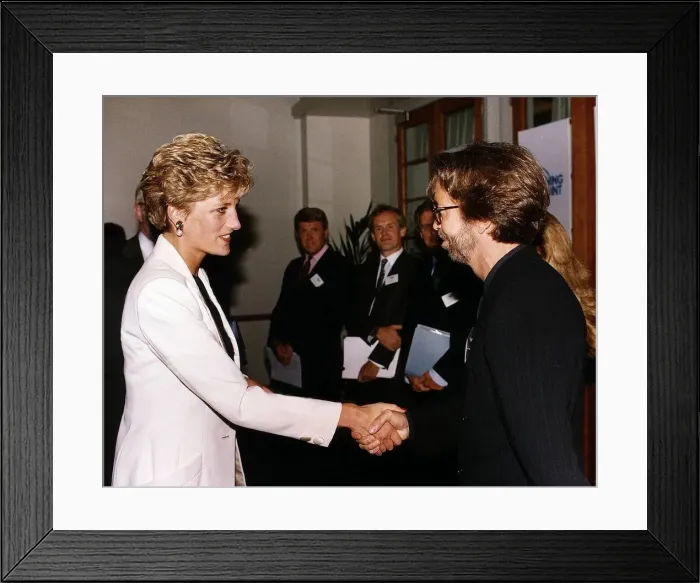 Framed Print : Princess Diana meets musician and singer Eric Clapton Rock at the charity film premiere Framed Print : Princess Diana meets musician and singer Eric Clapton Rock at the charity film premiere