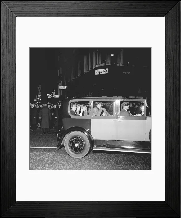 Framed Print : Paul McCartney and George Harrison of The Beatles with their girlfriends in the back of a Framed Print : Paul McCartney and George Harrison of The Beatles with their girlfriends in the back of a