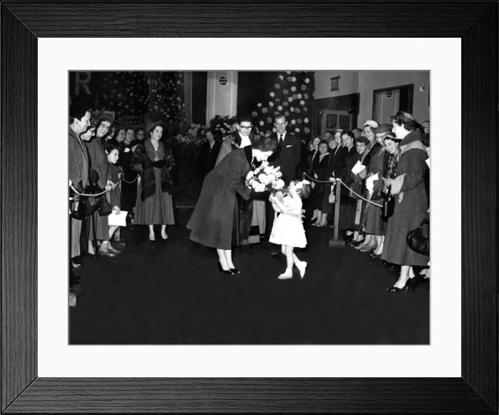 Framed Print : Queen Elizabeth II is presented with a bouquet by Margaret Elizabeth Brown during a visit Framed Print : Queen Elizabeth II is presented with a bouquet by Margaret Elizabeth Brown during a visit