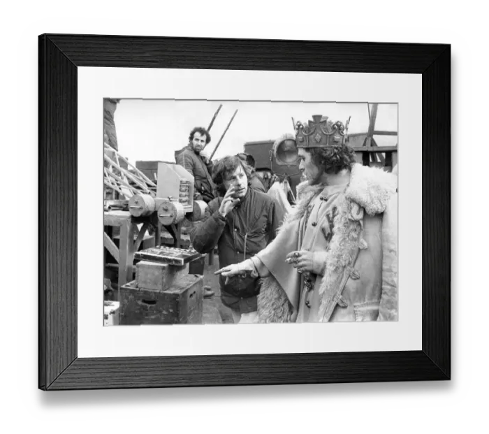 Framed Print : Film director Roman Polanski talks with actor Jon Finch who plays MacBeth in 1979