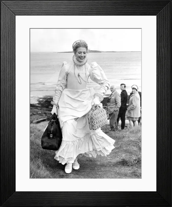 Framed Print : A Queen stepped ashore carrying an overnight bag in one hand