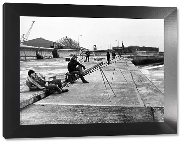 A group of anglers enjoying a spot of fishing on the pier at the mouth of the River Wear
