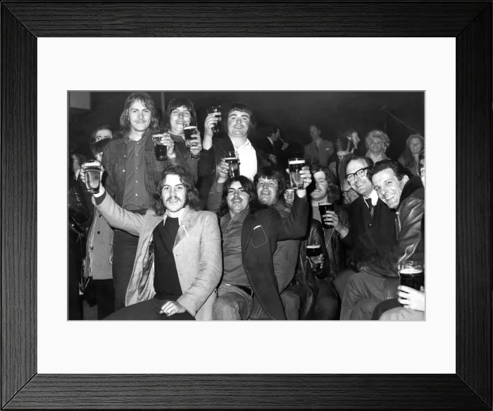 Framed Print : Cheers, Lads! It may be cold, it may be raining outside but these festival goers seem Framed Print : Cheers, Lads! It may be cold, it may be raining outside but these festival goers seem