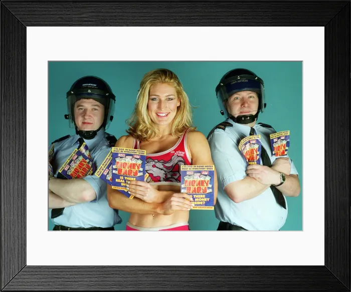 Framed Print : Gladiator Siren, January 1998 With 2 security guards for Daily Record money Framed Print : Gladiator Siren, January 1998 With 2 security guards for Daily Record money