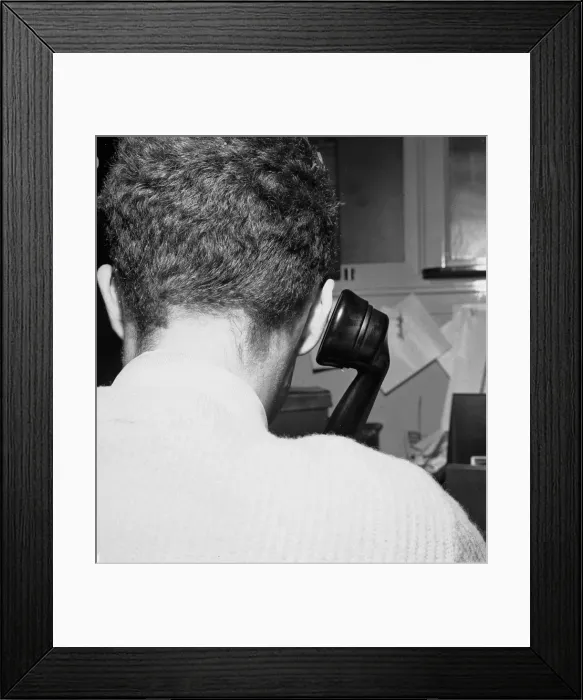 Framed Print : A man making a phone call from his office desk. 25th October 1957 Framed Print : A man making a phone call from his office desk. 25th October 1957