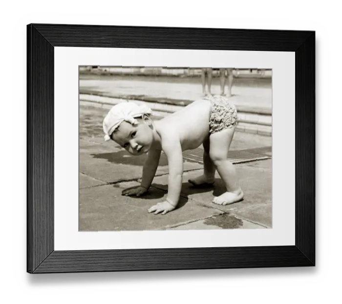 Framed Print : Little boy wearing a handkerchief on his head pictured balancing on all fours