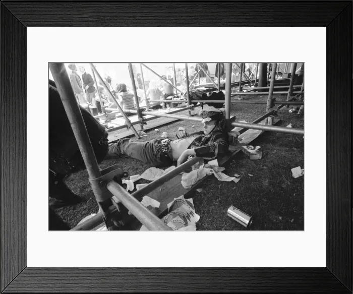 Framed Print : A drunken Hells Angel passed out during the pop concert in Hyde Park