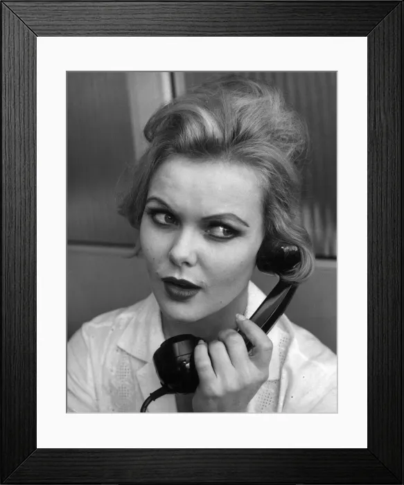 Framed Print : Applying Make up lessons with Jocylyne Wiseman. Woman talking on the telephone