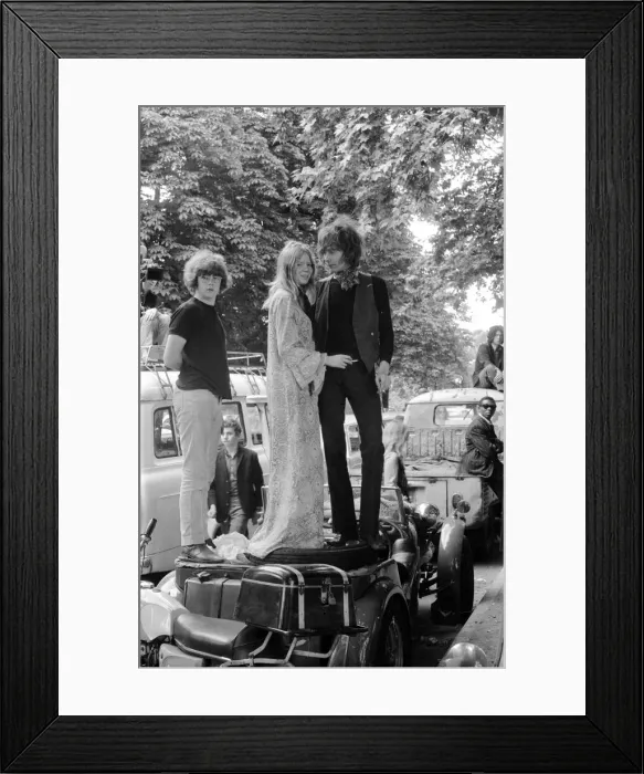 Framed Print : A couple standing on top of a pile of luggage in their car Framed Print : A couple standing on top of a pile of luggage in their car