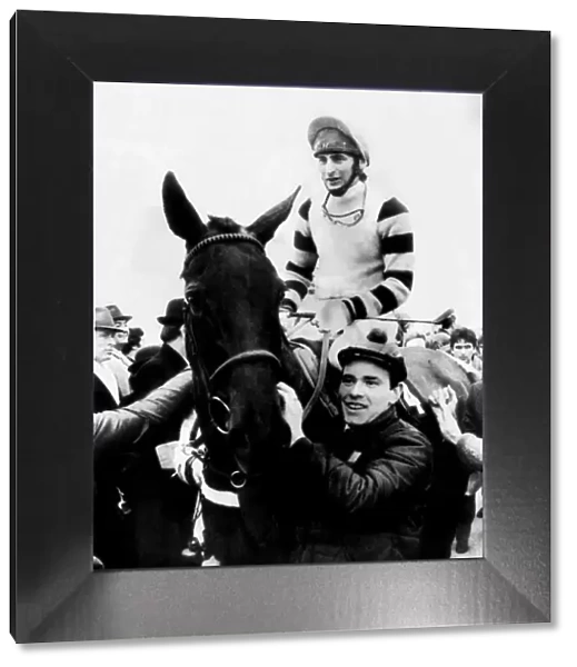 Jockey Phil Tuck on racehorse Burrough Hill Lad, being led into the winners enclosure