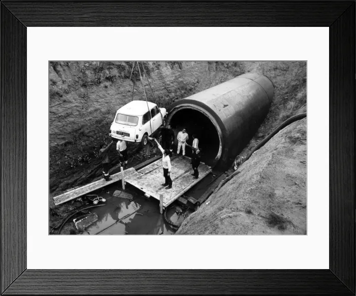 Framed Print : A Mini is lowered into Coventry sewers during the filming of The Italian Job Framed Print : A Mini is lowered into Coventry sewers during the filming of The Italian Job