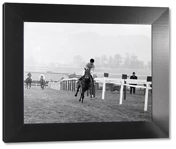 Jockey Pat Taaffe brings Arkle into the last straight before the last fence home on his