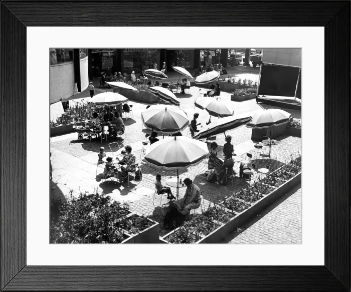 Framed Print : Shoppers relaxing below the circular Godiva Cafe in the Lower Precinct Framed Print : Shoppers relaxing below the circular Godiva Cafe in the Lower Precinct