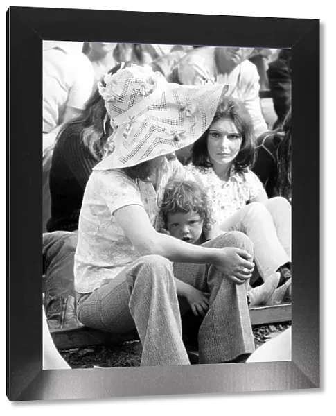 Music fan with young child at The Isle of Wight Festival. 30th August 1970