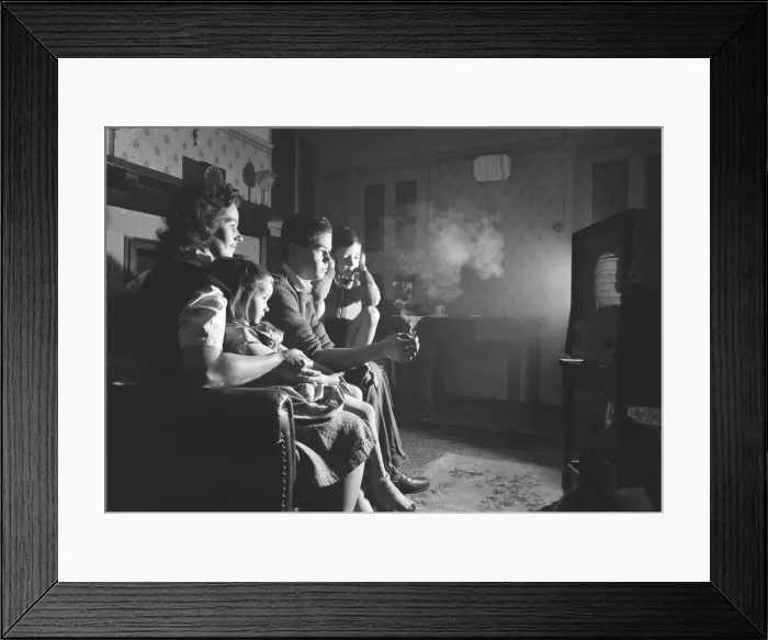 Framed Print : A evening in with the children, watching a coin-operated television Framed Print : A evening in with the children, watching a coin-operated television