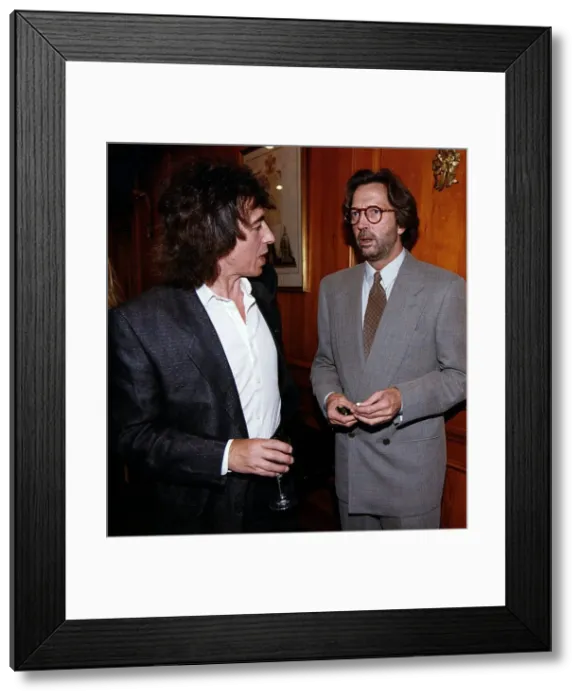 Framed Print : Eric Clapton at party chatting Framed Print : Eric Clapton at party chatting