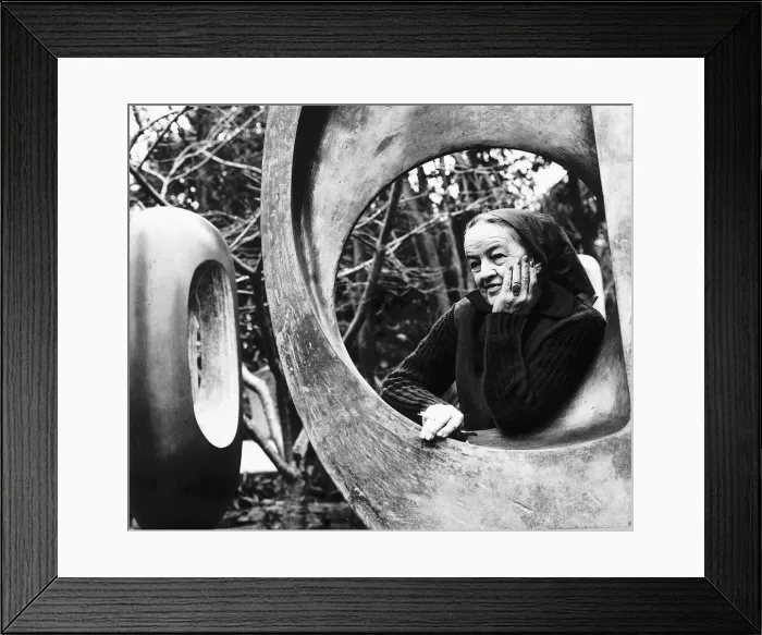 Framed Print : Barbara Hepworth sculptress in her garden January 1970 standing next to one of her
