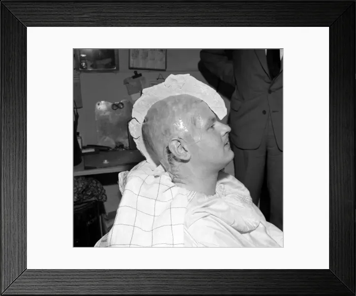 Framed Print : Comedian Benny Hill having a plaster cast of his skull made Framed Print : Comedian Benny Hill having a plaster cast of his skull made
