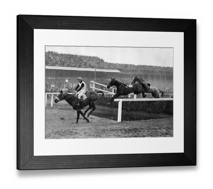 Framed Print : The Grand National 1947 Over the gaping water jump at Aintree