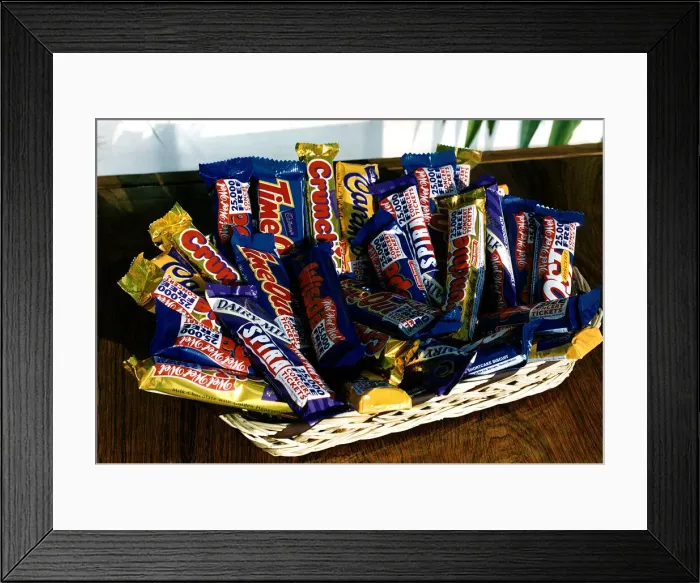 Framed Print : Cadbury Chocolate bars on table in wicker basket Framed Print : Cadbury Chocolate bars on table in wicker basket