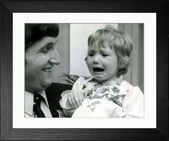 Framed Print : Eighteen month old Clare Timewall held by her father Chris crying her eyes out after Framed Print : Eighteen month old Clare Timewall held by her father Chris crying her eyes out after