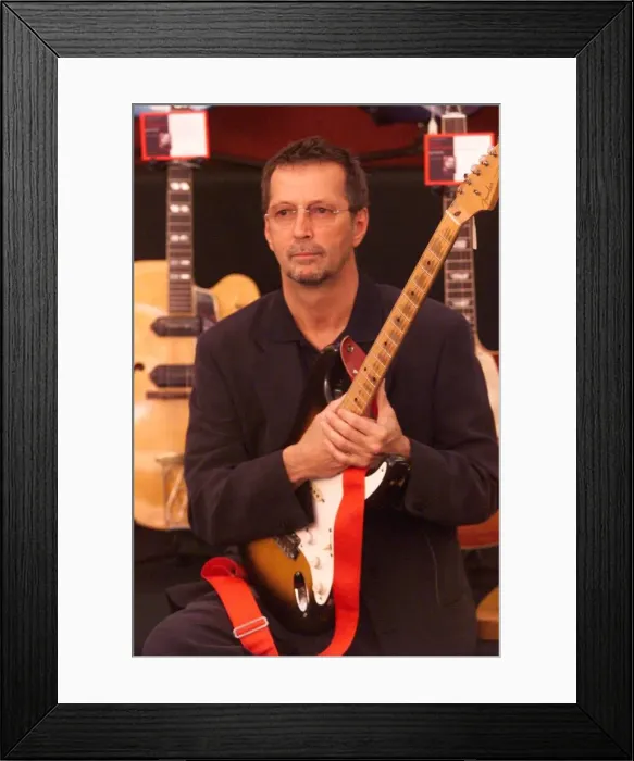 Framed Print : Eric Clapton guitar Legend June 1999 at the Launch of the Auction of his guitars he is Framed Print : Eric Clapton guitar Legend June 1999 at the Launch of the Auction of his guitars he is