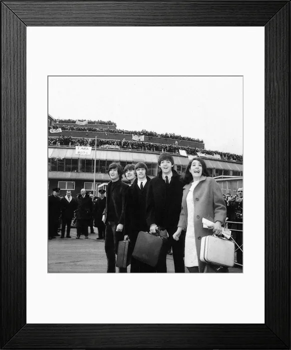 Framed Print : The Beatles and Eleanor Bron leave London Airport for the Bahamas to commence filming