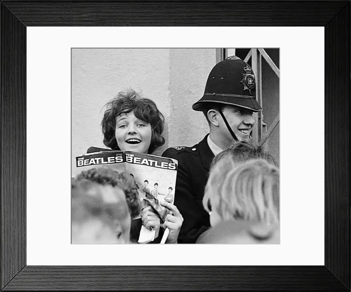 Framed Print : A fan holds a Beatles magazine in the crowd outside the Odeon Cinema, Cheltenham Framed Print : A fan holds a Beatles magazine in the crowd outside the Odeon Cinema, Cheltenham