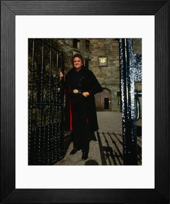 Framed Print : Johnny Cash at gates of castle Framed Print : Johnny Cash at gates of castle