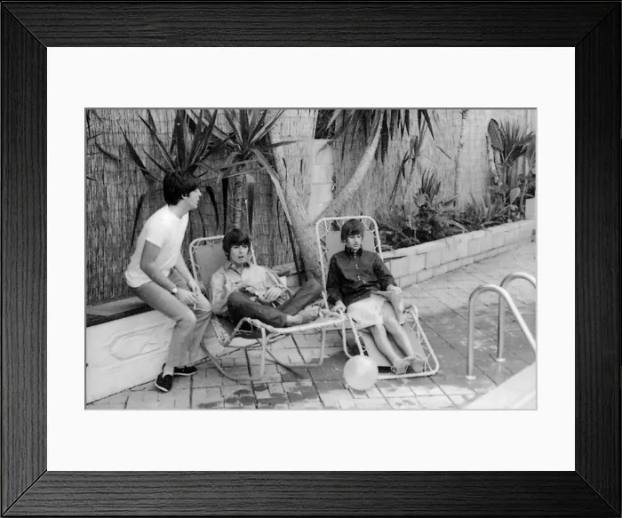 Framed Print : Paul McCartney, George Harrison and Ringo Starr relax on sun loungers at their rented