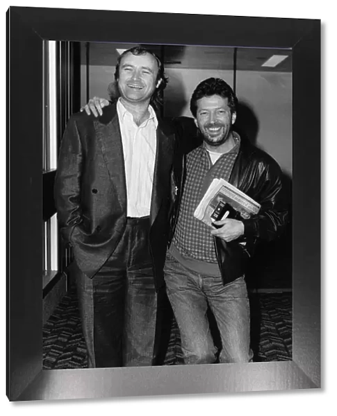 Phil Collins singer with Eric Clapton in 1987