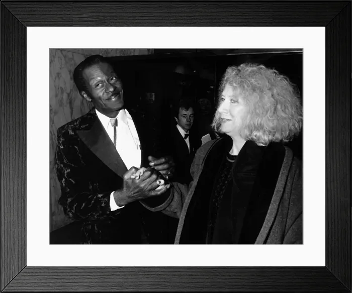 Framed Print : Chuck Berry greets woman at film premiere 1988 Holding hands
