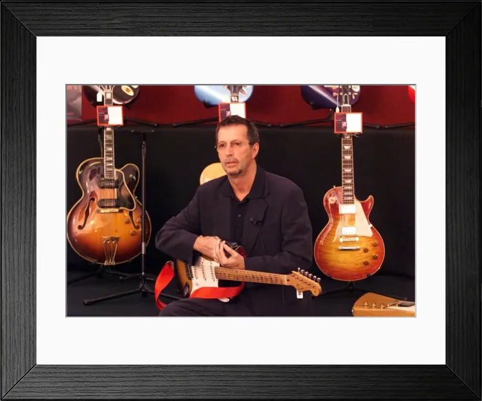 Framed Print : Eric Clapton guitar Legend June 1999 at the Launch of the Auction of his guitars he pis