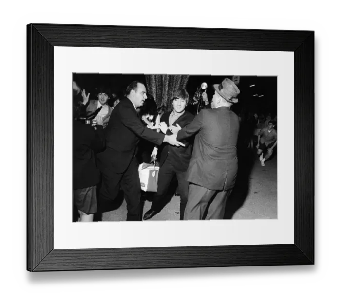 Framed Print : John Lennon and Paul McCartney escaping frenzied reporters at the Forest Hills Tennis