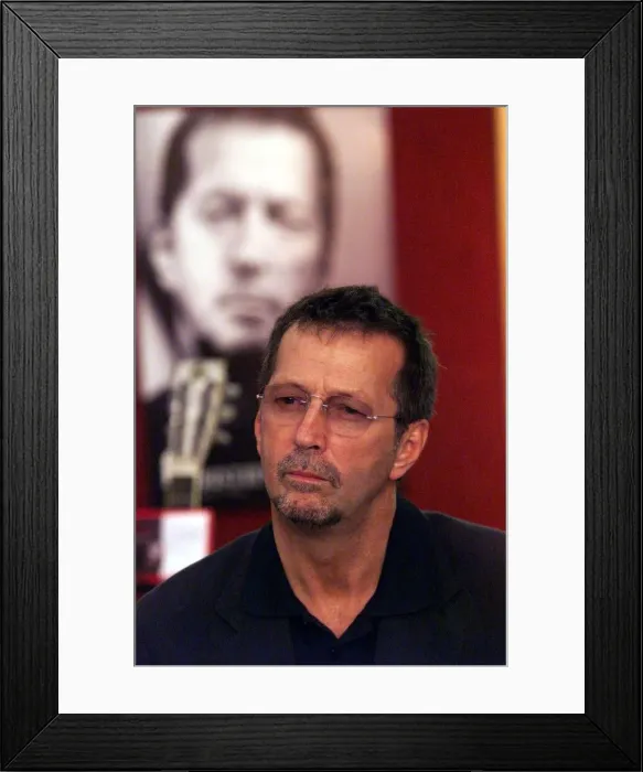Framed Print : Eric Clapton guitar Legend June 1999 at the Launch of the Auction of his guitars he is Framed Print : Eric Clapton guitar Legend June 1999 at the Launch of the Auction of his guitars he is
