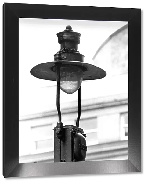 An old fashioned and outdated gas lamp and burner