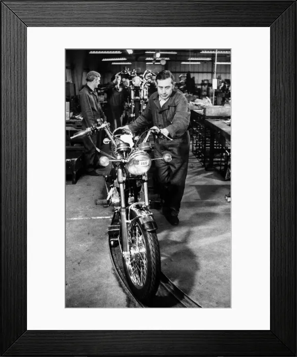 Framed Print : The first of many hopes. Mr. Don Yielding as he wheels a semi-completed motor cycle on to Framed Print : The first of many hopes. Mr. Don Yielding as he wheels a semi-completed motor cycle on to