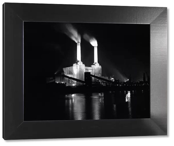 Battersea power station in London, illuminated at night at the time of