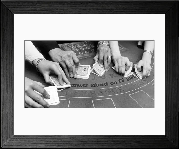 Framed Print : A deft twist, and the cards are smoothly shuffled, but it takes a lot of practice to work Framed Print : A deft twist, and the cards are smoothly shuffled, but it takes a lot of practice to work