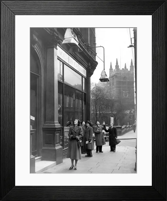 Framed Print : Passers-by looking up at the gas heaters outside the Northern Gas Board showrooms in Framed Print : Passers-by looking up at the gas heaters outside the Northern Gas Board showrooms in