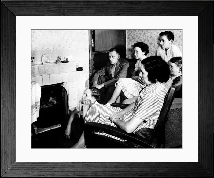 Framed Print : A family watch television together in their living room circa 1950 Framed Print : A family watch television together in their living room circa 1950