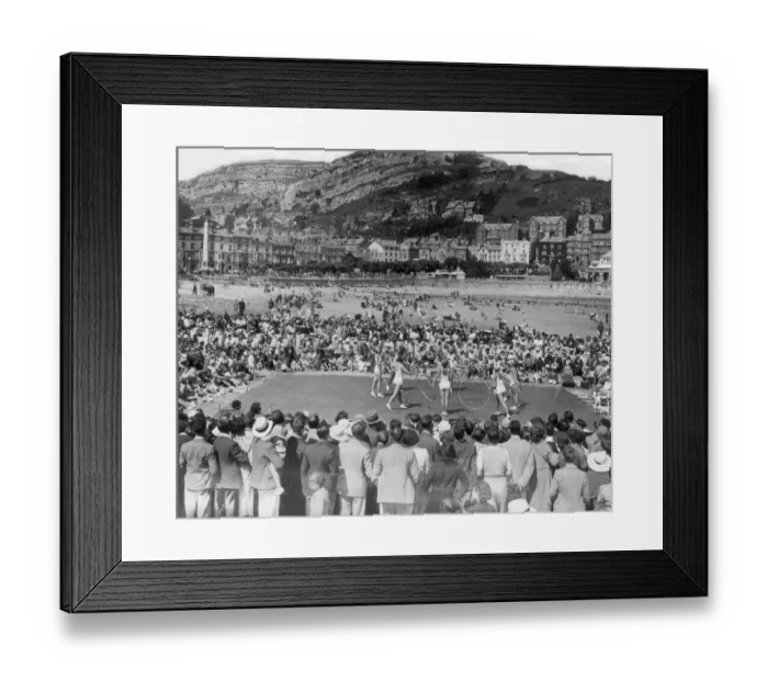 Framed Print : The Mirror 8 acrobatic display team entertain the crowd on the beach at Llandudno in Framed Print : The Mirror 8 acrobatic display team entertain the crowd on the beach at Llandudno in
